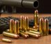 Assortment of ammunition types displayed on a rustic wooden surface, highlighting quality and selection for online shoppers