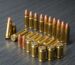 Assorted ammunition on a wooden table — buying ammo online